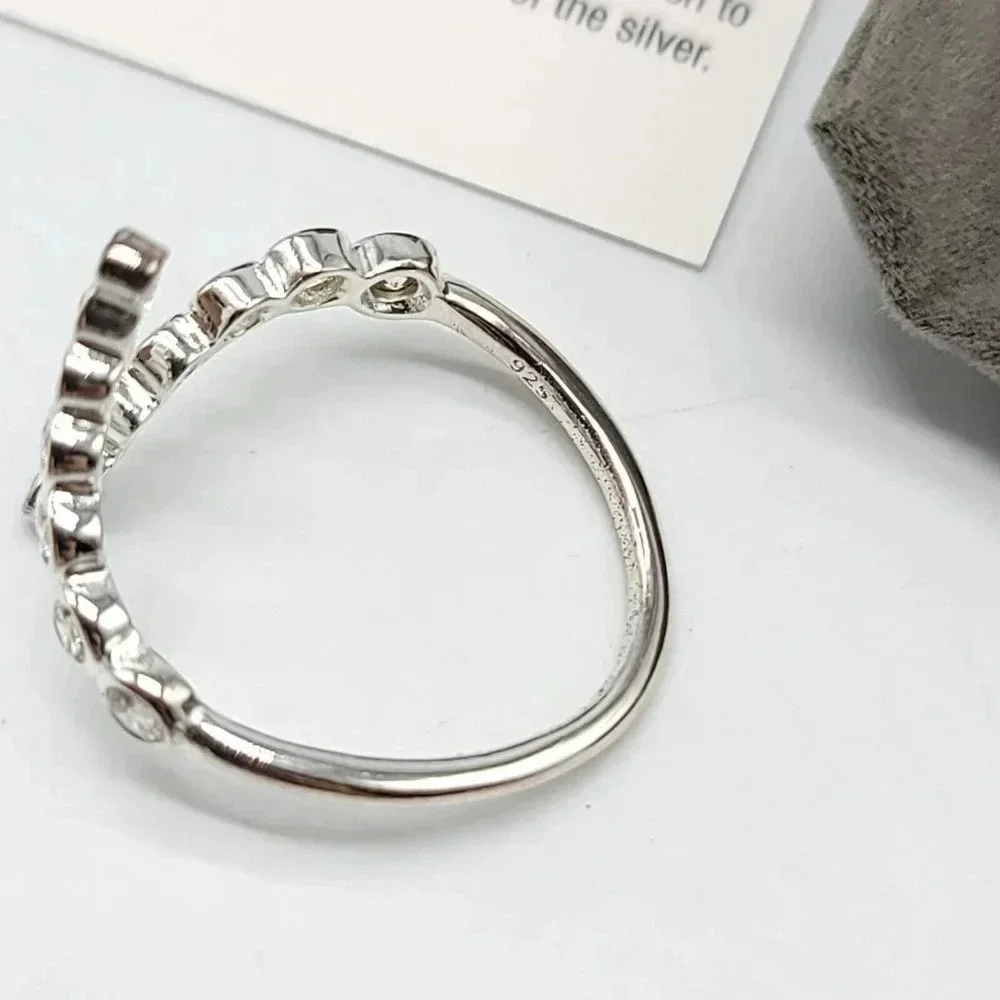 AVON Sterling Silver Graduated CZ Bypass Ring Embellished with CZ Size 7 NIB
